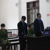 Bị cáo Đỗ Văn Đức và Lê Ngọc Trọng tại phiên tòa. (Ảnh: Vũ Hà/TTXVN)