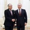 Chủ tịch nước Nguyễn Xuân Phúc hội đàm với Tổng thống Vladimir Putin trong chuyến thăm chính thức Liên bang Nga (30/11/2021). (Ảnh: TTXVN)