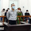Bị cáo Lê Văn Dũng tại phiên tòa xét xử. (Ảnh: Phạm Kiên/TTXVN)