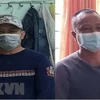 Bị can Nguyễn Văn Nhơn (bên trái) và Huỳnh Văn Lấm bị khởi tố, bắt giam về hành vi 'chống người thi hành công vụ.' (Ảnh: TTXVN phát)