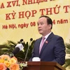 Chủ tịch Hội đồng Nhân dân thành phố Nguyễn Ngọc Tuấn phát biểu tại kỳ họp. (Ảnh: Văn Điệp/TTXVN)