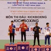 Trao huy chương cho các vận động viên nội dung Lowkick hạng dưới 60kg. Vận động viên Nguyễn Quang Huy (Việt Nam) giành huy chương Vàng. (Ảnh: Vũ Sinh/TTXVN)