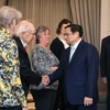 Thủ tướng Phạm Minh Chính tiếp những người bạn Hoa Kỳ ủng hộ nạn nhân da cam. (Ảnh: Dương Giang/TTXVN)