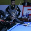 Vận động viên Trần Quyết Chiến (Việt Nam) thi đấu nội dung chung kết carom 3 băng. (Ảnh: Khánh Hòa/TTXVN)