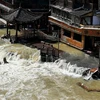 Nước lũ tràn qua một thị trấn tại tỉnh Hồ Nam, miền Trung Trung Quốc. (Nguồn: AP)