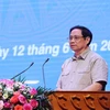 Thủ tướng Chính phủ Phạm Minh Chính gặp gỡ đối thoại với công nhân lao động năm 2022. (Ảnh: Dương Giang/TTXVN)