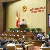 Quốc hội biểu quyết thông qua Nghị quyết kỳ họp thứ 3, Quốc hội khóa XV. (Ảnh: Doãn Tấn/TTXVN)