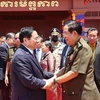 Thủ tướng Phạm Minh Chính và Thủ tướng Campuchia Hun Sen tại Lễ kỷ niệm 45 năm Con đường tiến tới đánh đổ chế độ diệt chủng Pol Pot của Thủ tướng Campuchia Hun Sen (20//6/1977-20/6/2022) ở tỉnh Tbong Khmum, sáng 20/6/2022. (Ảnh: Dương Giang/TTXVN)