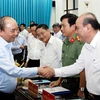 Chủ tịch nước Nguyễn Xuân Phúc với các đại biểu dự buổi làm việc. (Ảnh: Thống Nhất/TTXVN)