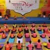 Hơn 600 người tham gia đồng diễn hưởng ứng Ngày Quốc tế Yoga năm 2022. Ảnh: Huỳnh Ngọc Sơn - TTXVN