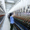 Dây chuyền sản xuất sợi tại nhà máy của Công ty Cổ phần VinaTex Hồng Lĩnh. (Ảnh: Vũ Sinh/TTXVN)