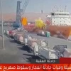 Đám khí màu vàng bùng lên sau khi một bồn chứa gas lớn rơi từ cần cẩu xuống con tàu đang neo đậu tại cảng Aqaba, Jordan ngày 27/6. (Ảnh: AFP/TTXVN)