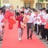Trường THPT Chuyên Hà Tĩnh đón học sinh ưu tú Phan Xuân Hành. (Ảnh: Hoàng Ngà/TTXVN)