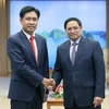 Thủ tướng Phạm Minh Chính tiếp Bộ trưởng Bộ Tư pháp Lào Phayvy Xibualypha. (Ảnh: Dương Giang/TTXVN)