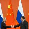 Tổng thống Nga Vladimir Putin (trái) và Chủ tịch Trung Quốc Tập Cận Bình. (Nguồn: AP)