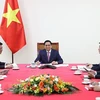 Thủ tướng Phạm Minh Chính điện đàm với Thủ tướng Trung Quốc Lý Khắc Cường. (Ảnh: Dương Giang/TTXVN)