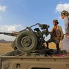 Quân chính phủ Yemen trong một cuộc giao tranh với lực lượng Houthi. (Ảnh: AFP/TTXVN)