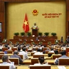 Bộ trưởng Bộ Thông tin và Truyền thông Nguyễn Mạnh Hùng trả lời chất vấn. (Ảnh: Doãn Tấn/TTXVN)