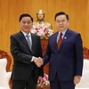 Chủ tịch Quốc hội Lào Xaysomphone Phomvihane tiếp ông Trần Cẩm Tú, Chủ nhiệm Ủy ban Kiểm tra Trung ương đến chào xã giao. (Ảnh: Phạm Kiên/TTXVN)