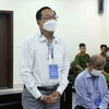 Bị cáo Cao Minh Quang (sinh năm 1956, cựu Thứ trưởng Bộ Y tế) khai báo trước tòa. (Ảnh: Phạm Kiên/TTXVN)