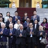 Chủ tịch nước Nguyễn Xuân Phúc với các đại biểu. (Ảnh: Thống Nhất/TTXVN)