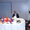 Thủ tướng Phạm Minh Chính, Thủ tướng Campuchia Samdech Techo Hun Sen và Thủ tướng Lào Phankham Viphavanh ăn sáng và làm việc. (Ảnh: Dương Giang/TTXVN)