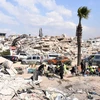 Lực lượng cứu hộ tìm kiếm nạn nhân tại hiện trường đổ nát sau động đất ở Antakya, tỉnh Hatay, Thổ Nhĩ Kỳ. (Ảnh: THX/TTXVN)