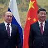 Chủ tịch Trung Quốc Tập Cận Bình (phải) và Tổng thống Nga Vladimir Putin tại một cuộc gặp. (Ảnh: AFP/TTXVN)