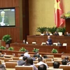 Chánh án Tòa án Nhân dân Tối cao Nguyễn Hòa Bình trả lời chất vấn. (Ảnh: Doãn Tấn/TTXVN)