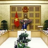 Phó Thủ tướng Lê Minh Khái phát biểu tại buổi gặp mặt. (Ảnh: An Đăng/TTXVN)