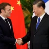 Tổng thống Pháp Emmanuel Macron và Chủ tịch Trung Quốc Tập Cận Bình. (Nguồn: DW)