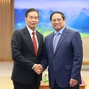 Thủ tướng Phạm Minh Chính tiếp ông Sinlavong Khoutphaythoune, Chủ tịch Ủy ban Trung ương Mặt trận Lào xây dựng đất nước. (Ảnh: Dương Giang/TTXVN)