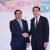 Thủ tướng Phạm Minh Chính và Thủ tướng Nhật Bản Fumio Kishida. (Ảnh: Dương Giang/TTXVN)