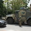 Các tay súng Tập đoàn quân sự tư nhân Wagner gác trên đường phố ở thành phố Rostov-on-Don, miền Nam Nga ngày 24/6. (Ảnh: AFP/TTXVN)