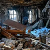 Bên trong tòa nhà Trường Đại học Kharkiv ở vùng Kharkiv, Ukraine bị phá hủy do xung đột. (Ảnh: AFP/TTXVN)
