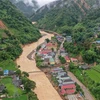 Toàn cảnh trung tâm xã Hồ Bốn, huyện Mù Cang Chải, tỉnh Yên Bái bên cạnh dòng nước lũ. (Ảnh: Tuấn Anh/TTXVN)