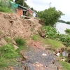 Khu vực sạt lở bờ sông tại xã Phú Đức, huyện Long Hồ, tỉnh Vĩnh Long. (Ảnh: Lê Thúy Hằng/TTXVN)