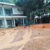 Sạt lở khiến đất đá tràn vào Trường Tiểu học và Trung học Cơ sở xã Đức Hạnh, huyện Bảo Lâm, tỉnh Cao Bằng. (Ảnh: TTXVN phát)