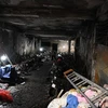 Hiện trường vụ cháy chung cư mini trong phố Khương Hạ, Thanh Xuân, Hà Nội. (Ảnh: Dương GiangTTXVN)