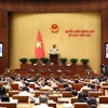 Quốc hội nghe trình bày Báo cáo về Tình hình Kinh tế-Xã hội. (Ảnh: Phạm Kiên/TTXVN)