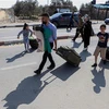 Người dân chuẩn bị rời khỏi Gaza qua Cửa khẩu Rafah ngày 1/11. (Ảnh: THX/TTXVN)