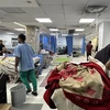 Bệnh nhân điều trị tại bệnh viện Al-Shifa ở Dải Gaza. (Ảnh: AFP/TTXVN)