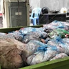 Xe chất đầy các túi mỡ bẩn được phát hiện tại gia đình bà Nguyễn Thị Vân. (Nguồn: Công an tỉnh Vĩnh Phúc)