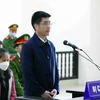 Bị cáo Hoàng Văn Hưng, cựu cán bộ công an khai báo trước tòa. (Ảnh: Phạm Kiên/TTXVN)
