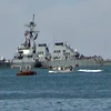 Tàu khu trục USS Cole của Mỹ bị hư hại nghiêm trọng sau một vụ tấn công liều chết trên Vịnh Aden. (Ảnh: AFP/TTXVN)