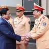 Thủ tướng Phạm Minh Chính thăm, chúc Tết lực lượng cảnh sát Giao thông. (Ảnh: Dương Giang/TTXVN)