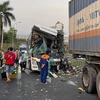 Hiện trường vụ va chạm giữa xe khách và xe đầu kéo trên đường dẫn vào trạm dừng chân Cao tốc Thành phố Hồ Chí Minh-Long Thành-Dầu Giây. (Ảnh: TTXVN phát)