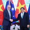 Thủ tướng Phạm Minh Chính và Thủ tướng Australia Anthony Albanese. (Ảnh: Dương Giang/TTXVN)