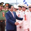 Thủ tướng Phạm Minh Chính với lãnh đạo Bộ Công an tham dự Lễ kỷ niệm. (Ảnh: Dương Giang/TTXVN)