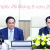 Thủ tướng Phạm Minh Chính phát biểu tại Hội nghị đánh giá việc thực hiện quy chế về mối quan hệ công tác giữa Chính phủ với Tổng Liên đoàn Lao động Việt Nam. (Ảnh: Dương Giang/TTXVN)